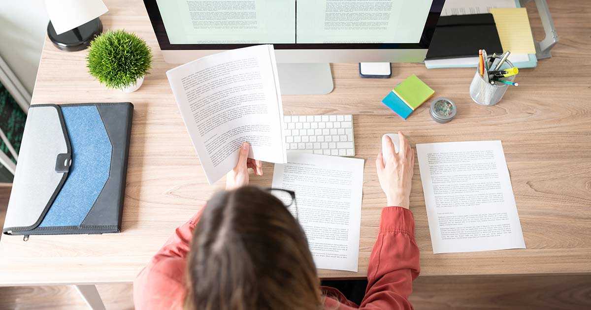 person checking printed content work